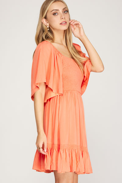 HALF FLUTTER SLEEVE WOVEN SMOCKED DRESS WITH BACK TIED DETAIL